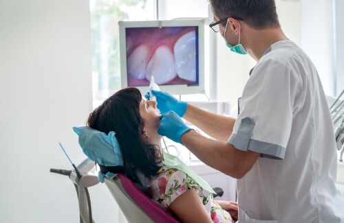 Dentist giving a patient a dental exam