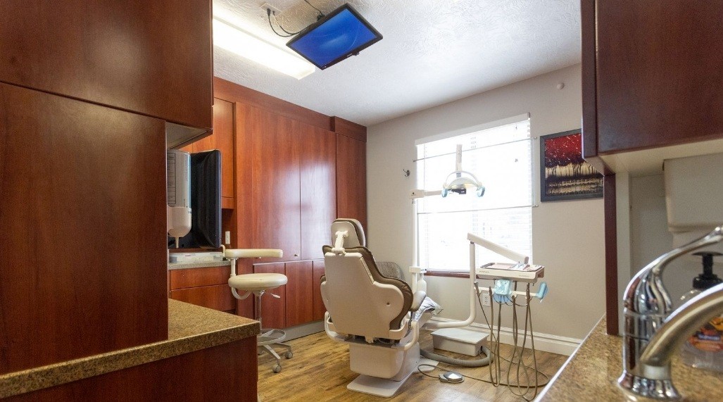Reception area with two dental team members at front desk