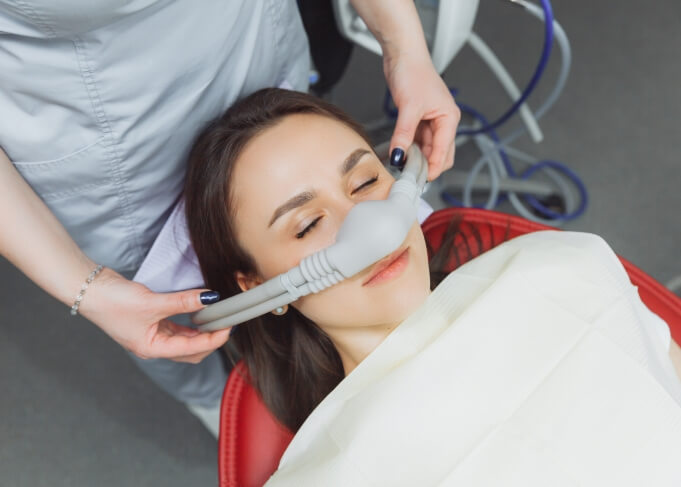 Woman relaxing in dental chair thanks to sedation dentistry in Grantsville